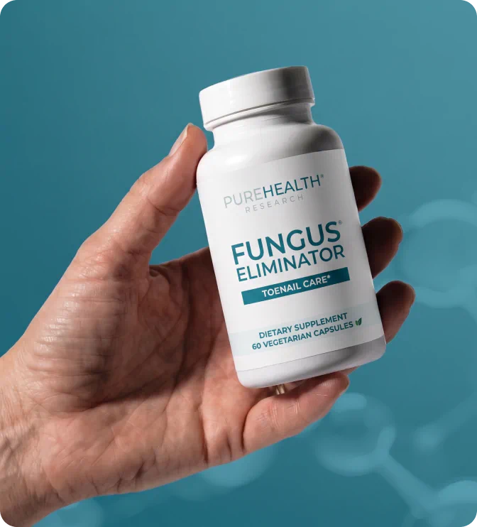 Hand holding Fungus Eliminator bottle